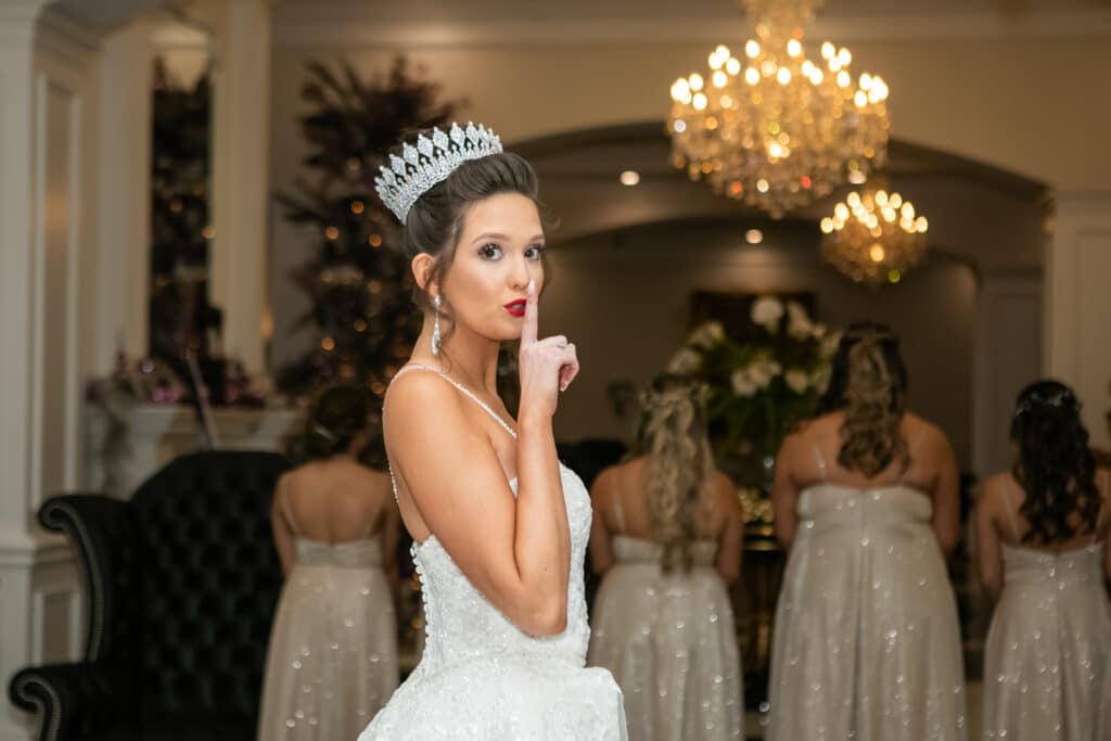 bride telling the camera operator to be quiet as she approaches her bridesmaids behind her, Dream Day Digital, Orlando, FL