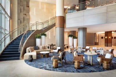 grand staircase on the left, lobby area on the right, comfortable seating, Orlando, FL