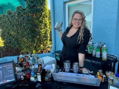 bartender shaking a drink at the bar, reception, outdoors, Orlando, FL