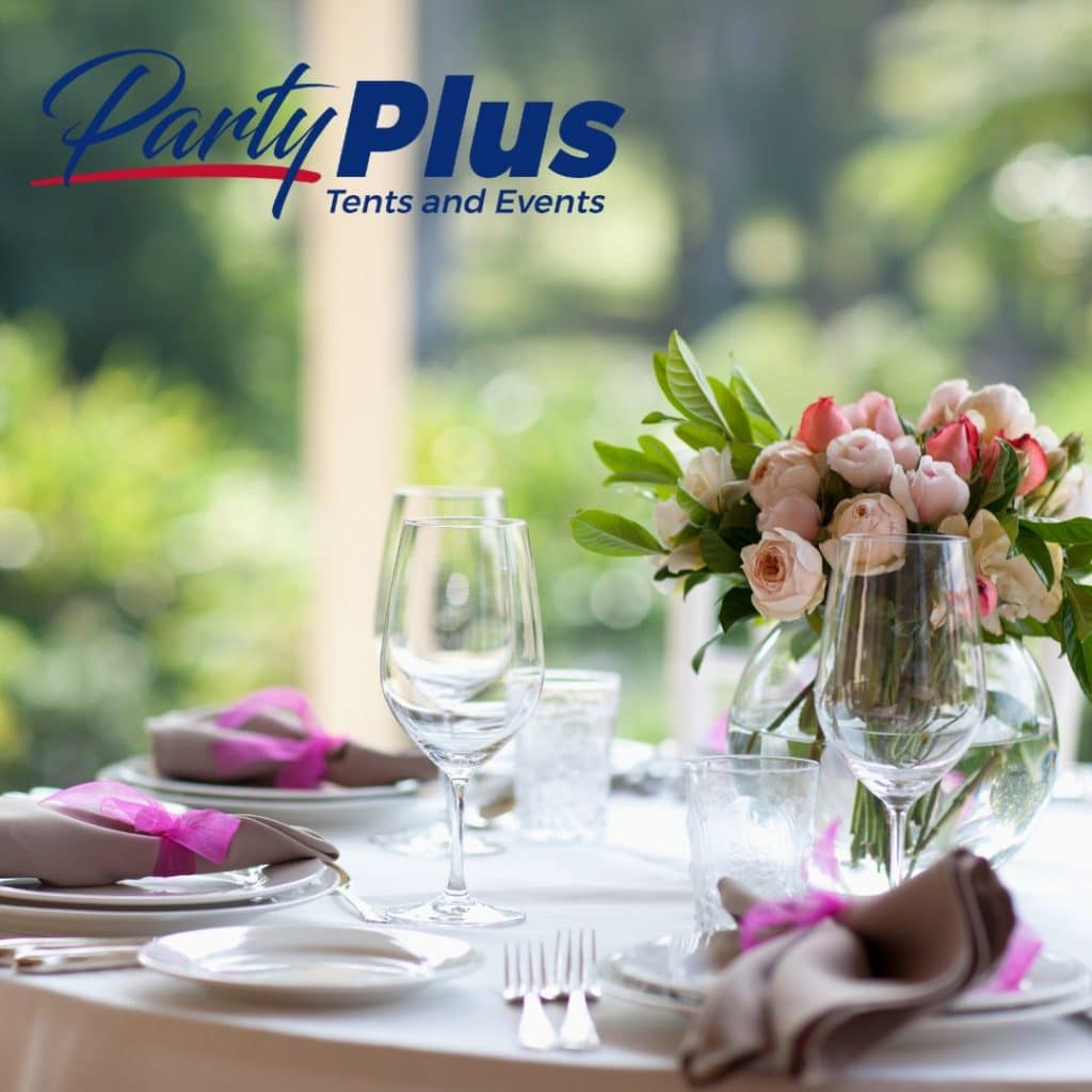 flowers on the center of a table, white plates with brown napkins and purple ribbons, Party Plus Tents and Events, Orlando, FL