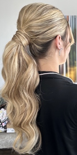 Up do hairstyle on blonde hair by About Face Design Team