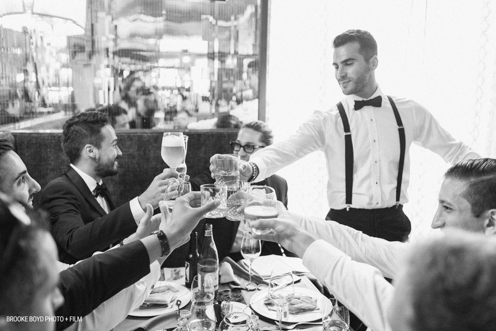 black and white image of intimate wedding with guests