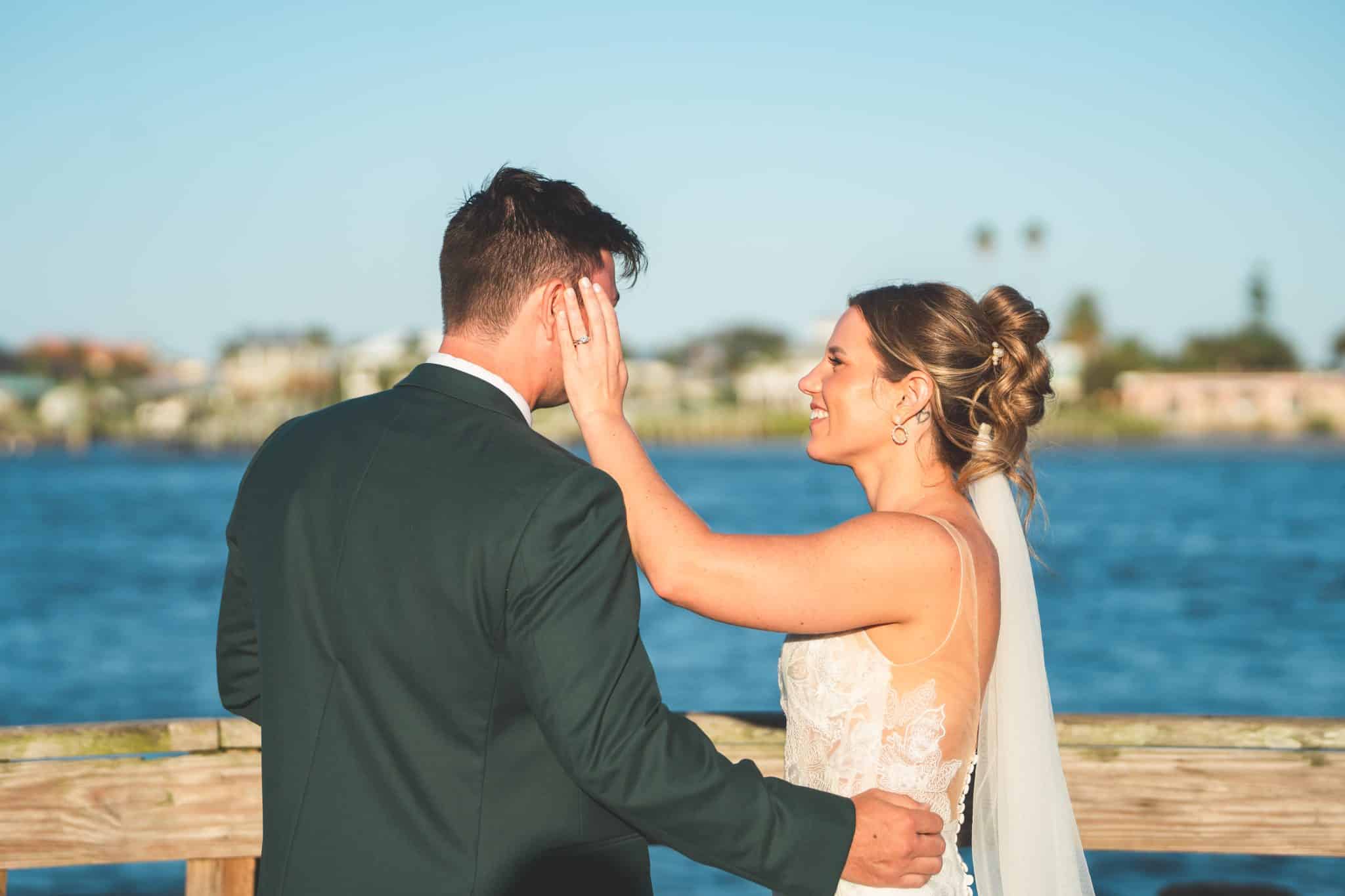 couple overlooking a gorgeous lake ready to embrace each other