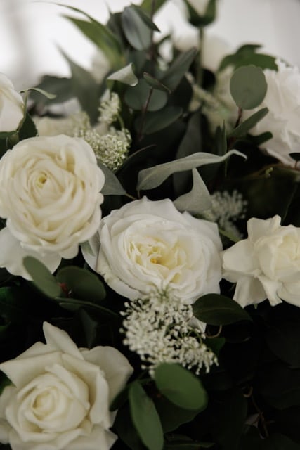 arrangement of greenery with white florals