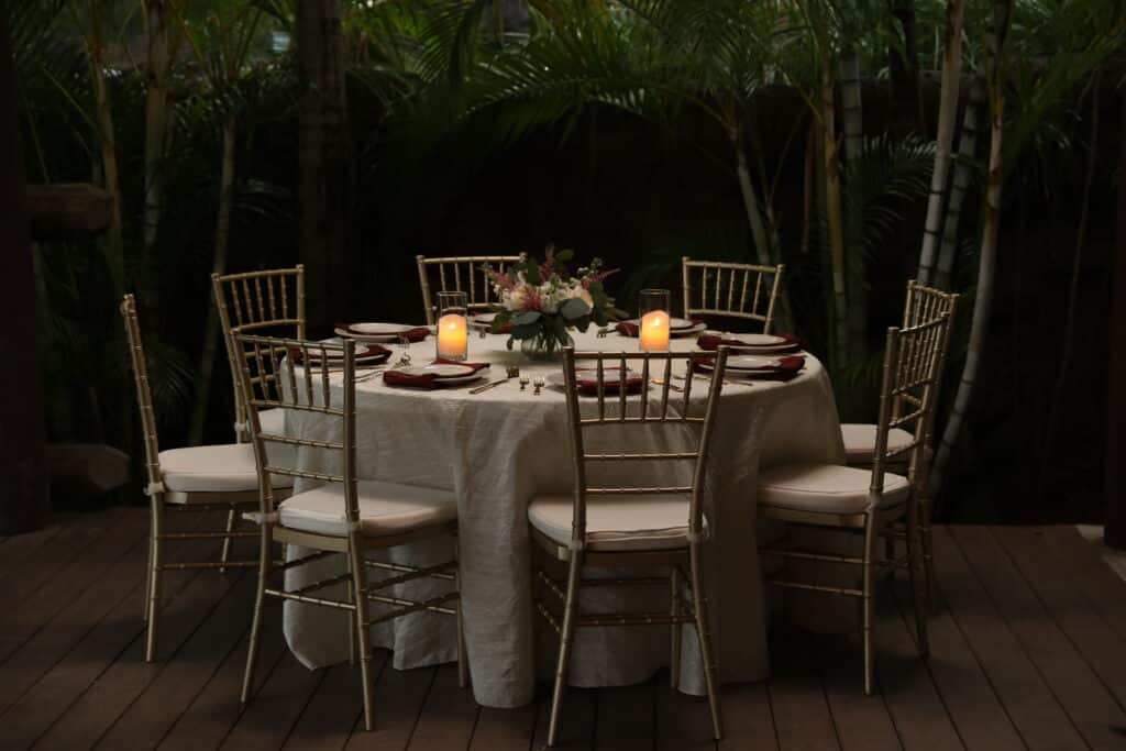 reception table, votive candles lit, outdoors, Orlando, FL