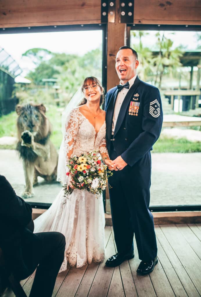 bride and groom posing for the camera at the lodge at Brevard Zoo, Orlando, FL