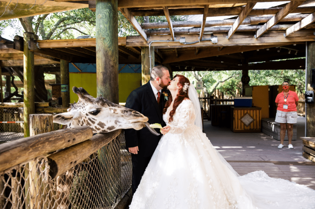 bride and groom kissing at the lodge at the Brevard Zoo, Orlando, FL