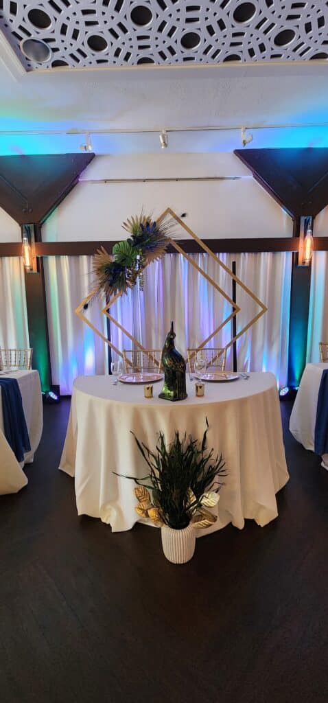 reception table set up, square centerpiece, white tablecloth, Orlando, FL