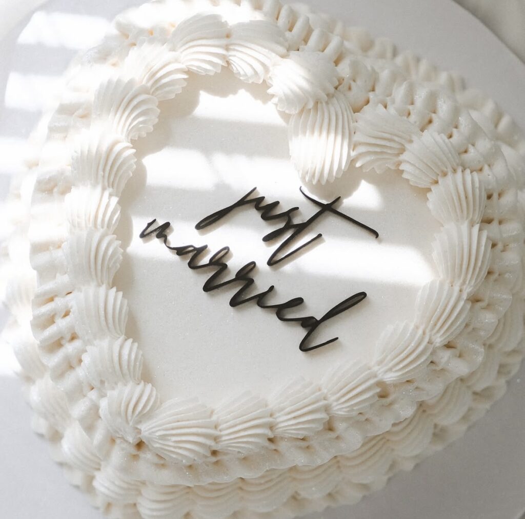 one layer, white cake, buttercream frosting, just married written on top, Iced by Taylor, Orlando, FL