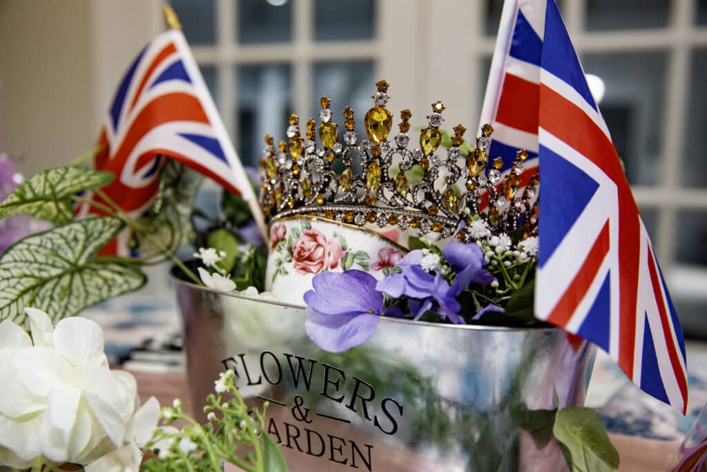 metal bucket with a crown, English flags and a floral tea cup, purple flowers, Houses of Windsor, Orlando, FL