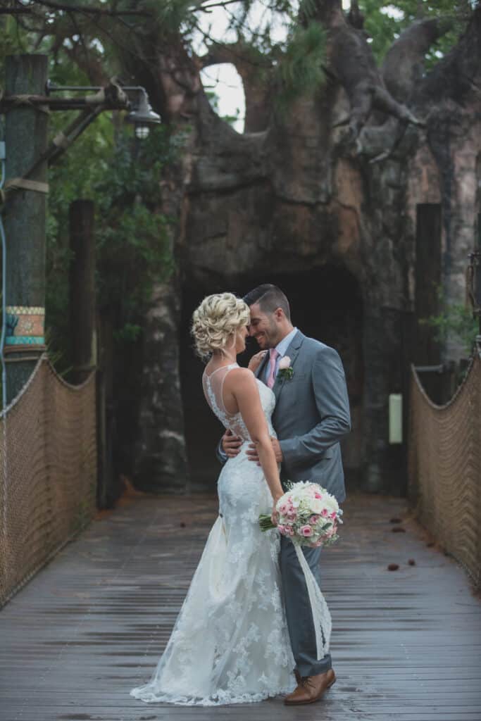 bride and groom kissing on the bridge, Brevard Zoo, Orlando, FL