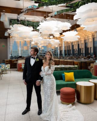 bride and groom walking through the bar area of the hotel, Orlando, FL