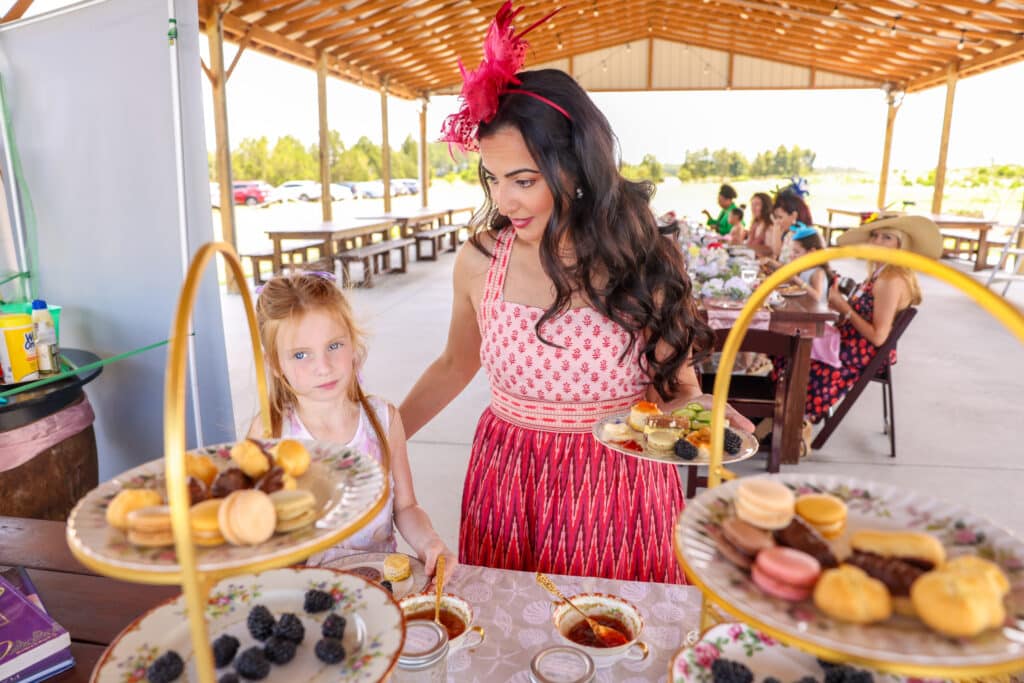 mother and daughter comtemplating their dessert choices at the tea party, Houses of Windsor, Orlando, FL