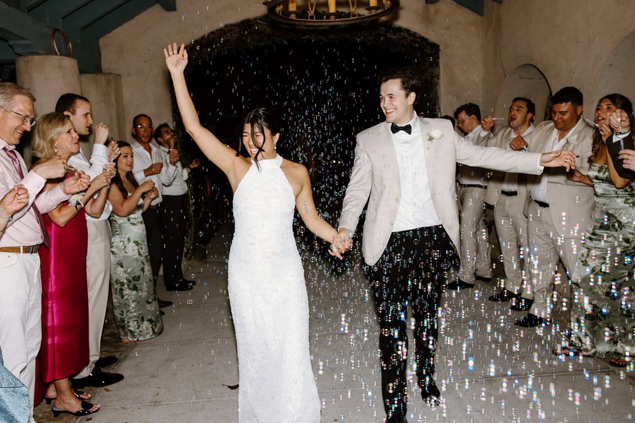 Couple celebrating their grand exit with bubbles 