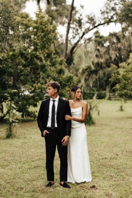 bride and groom walking on the lawn, wedding day, outdoors, Uliana Estate, Orlando, FL