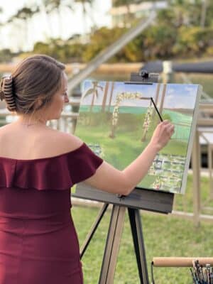 artist painting outside on the lawn, Keepsake Studio, Orlando, FL
