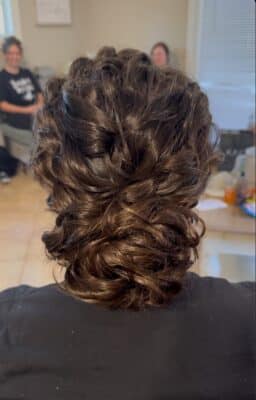 close up of a woman's hairstyle, shoulder length hair, curly, pulled back and secured with bobby pins, M. Anselmi Design Studio, Orlando, FL