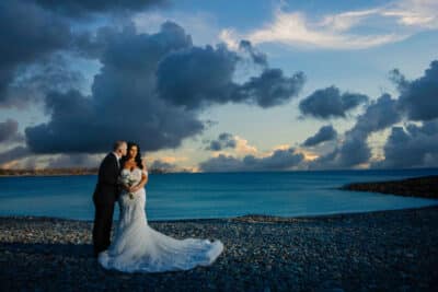 bride and groom on the beach, clouds in the sky, sunset, Sonacity Photography, Orlando, FL