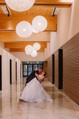 hallway of the venue, bride and groom kissing, Bonnet Springs Park, Orlando, FL