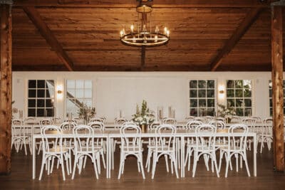 reception hall, long table with white table, set for dinner, wood paneling and exposed wood beams, Orlando, FL