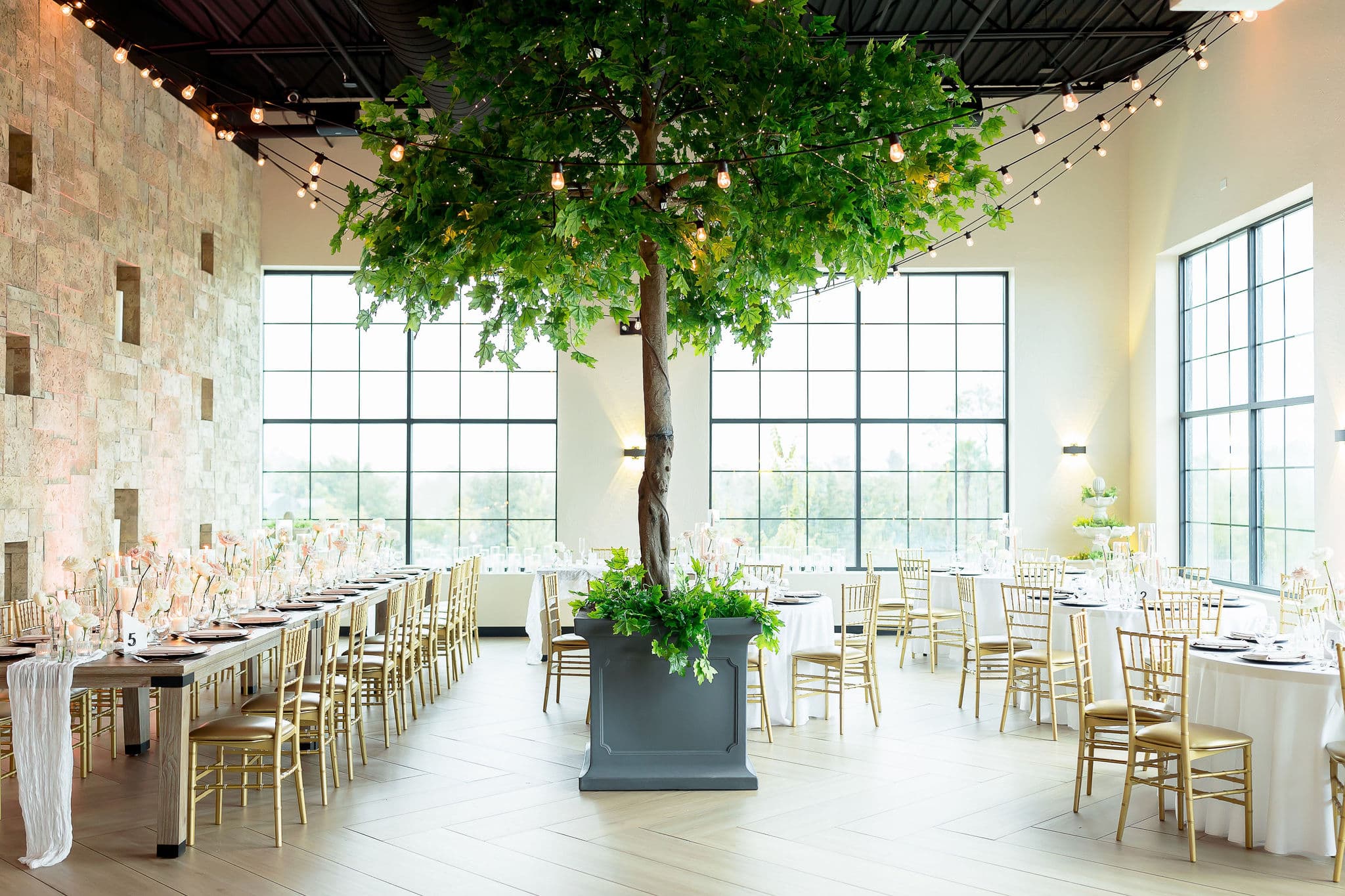 New York Botanical Garden ballroom area with a gorgeous tree in the middle to celebrate a timeless and chic wedding 