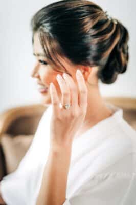 bride in her bridal robe, hair updo, make up done, waiting for the wedding ceremony, Orlando, FL