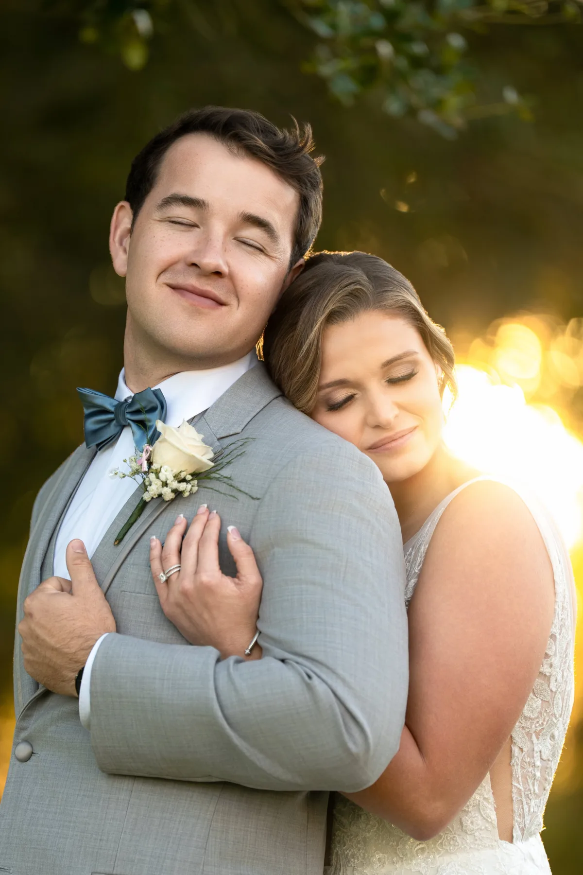 romantic bride and groom during golden hour cuddled together