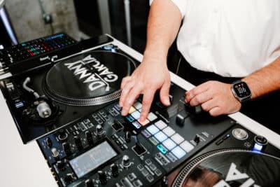 DJ Danny Garcia on the mixing board, reception, Orlando, FL
