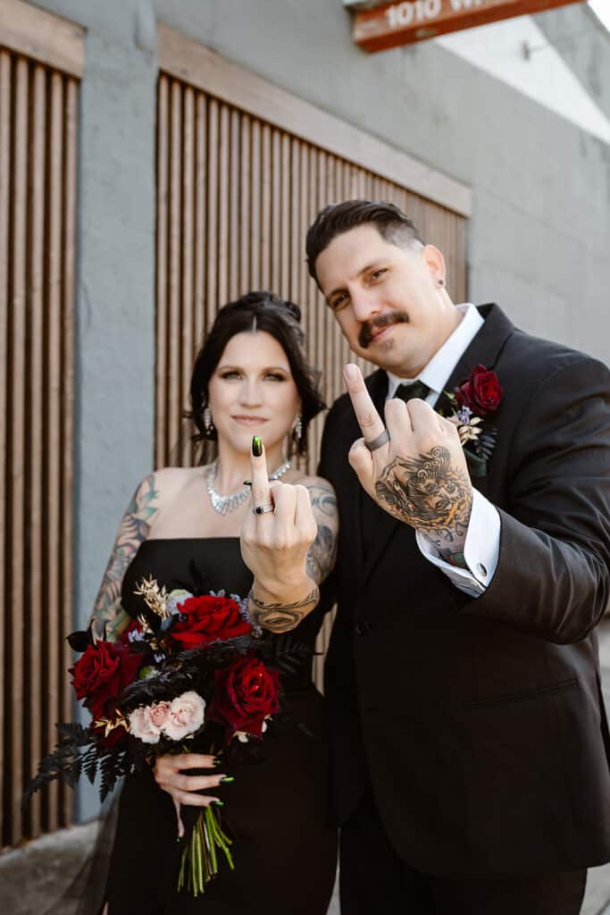 couple showing ring fingers on image