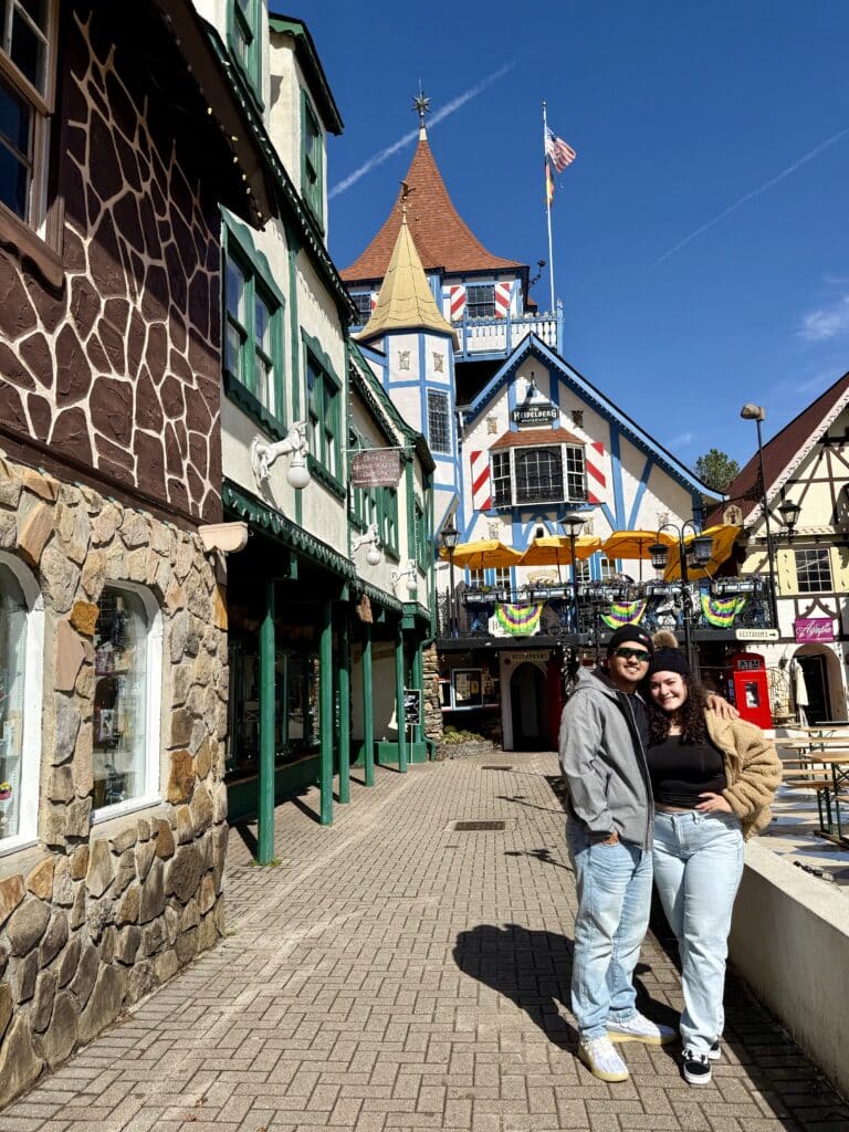 Picture of a couple posing in a theme park. 