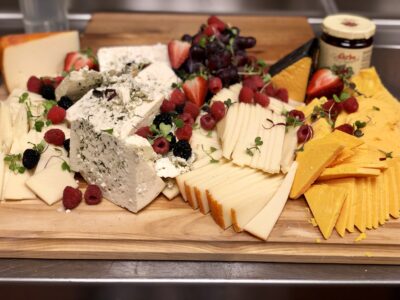 board of various cheeses, strawberries and pomegranate seeds, Orlando, FL
