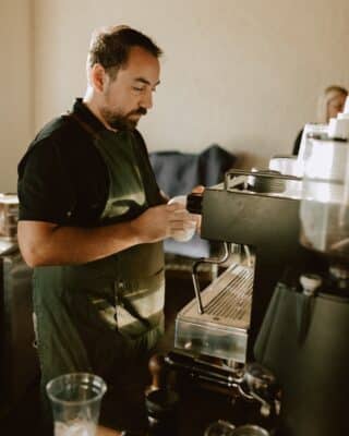 barista making espresso drinks for guests, coffee cart, Orlando, FL