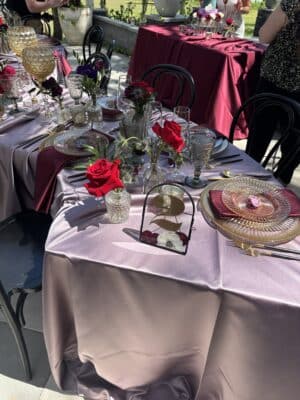 table 2, red roses, violet tablecloths, clear chargers, maroon napkins, Lyzmily's Flower Preservation, Orlando, FL