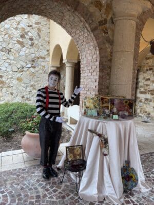 mime showing the display of the pressed flowers, Orlando, FL