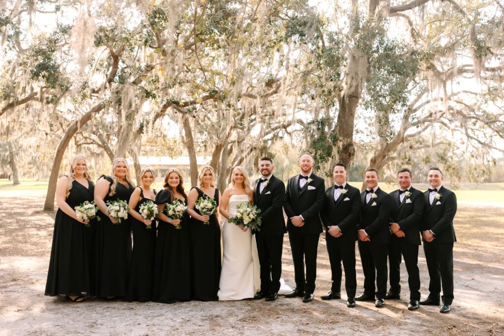 wedding party with the bride and groom, outdoors, near trees, Legacy at Oak Meadows, Orlando, FL