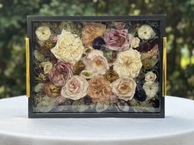display of pressed flowers, yellow, pink, orange, white, in a shadow box, Orlando, FL