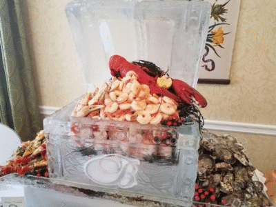 large seafood display, shrimp, lobster, oysters on ice, Orlando, FL
