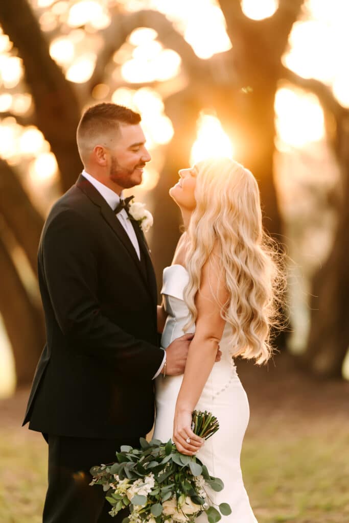 bride and groom looking into each other's eyes, sunset, outdoors, Legacy at Oak Meadows, Orlando, FL