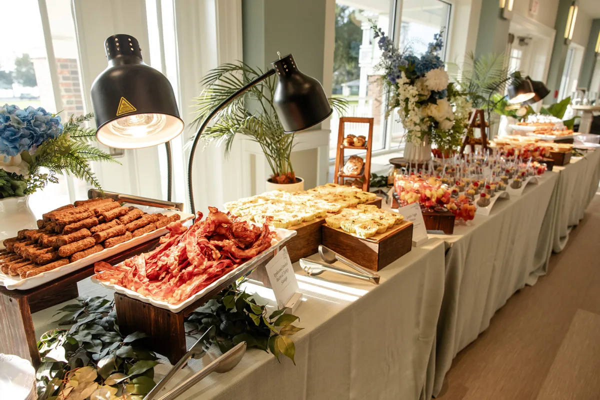 Elegant wedding catering buffet by Done Wright Culinary Services at the Wedding Venue Map Beyond the Aisle showcase in Orlando, featuring gourmet appetizers and wedding reception décor.