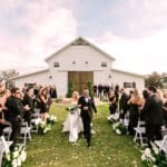 bride and groom walking out of the chapel at Legacy at Oak Meadows, Orlando, FL