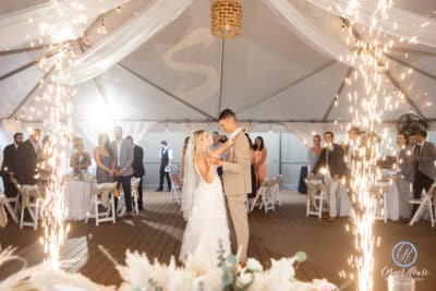 bride and groom dancing at their reception, outdoor tent, sparklers, guests watching from the sides, Crowne Plaza Melbourne Oceanfront, Orlando, FL