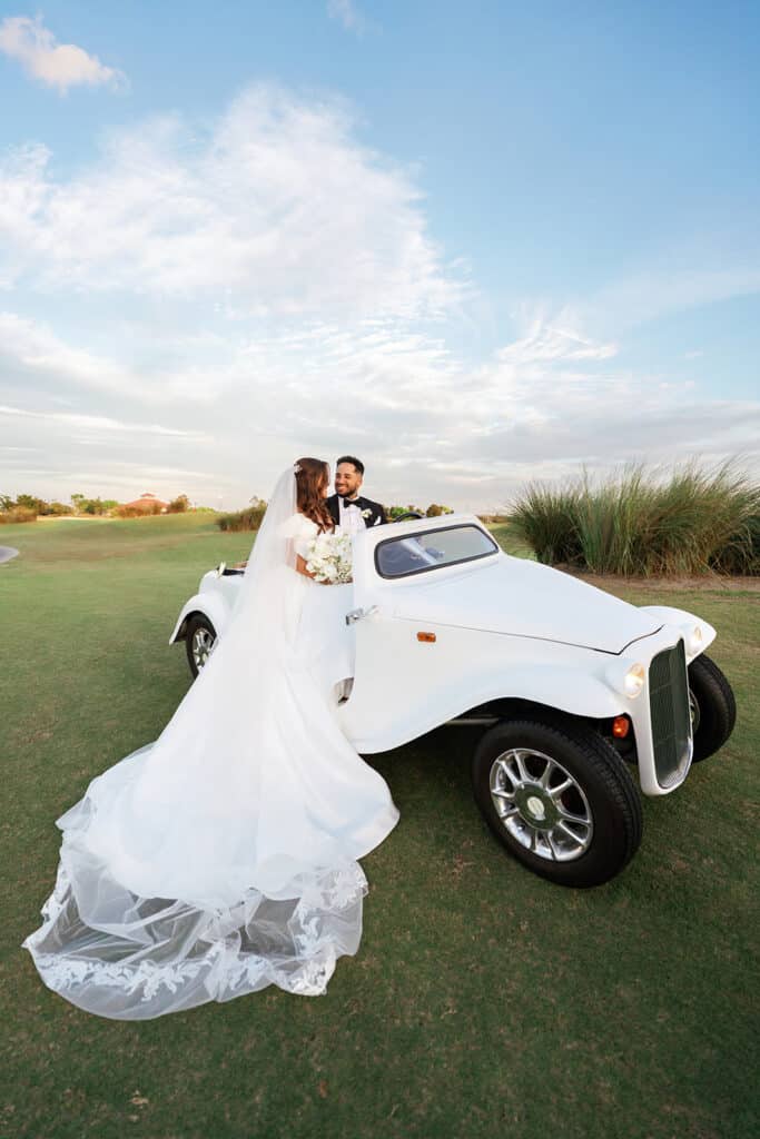 bride and groom with their white ATV on the lawn, The Royal Crest Room, Orlando, FL