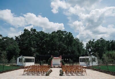 zoomed out photo of the wedding ceremony set up, outdoors, Villa Serafina, Orlando, FL