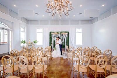 indoor wedding ceremony set up, bride and groom at the altar, Heller Hall at Winter Garden Heritage Foundation, Orlando, FL