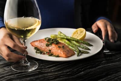 salmon, asparagus, lemon wedge, glass of white wine, Fogo de Chão Vineland, Orlando, FL