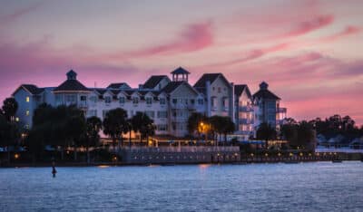 The Waterfront Inn, view from across the water, night time, purple sky, Orlando, FL