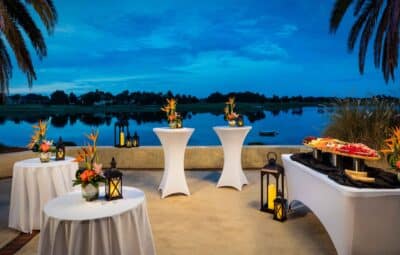 outdoor cocktail reception, small round tables, cocktail tables, appetizer table, waterfront, palm trees, Orlando, FL