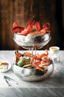 seafood tower in a silver display, warmed butter, cocktail sauce, Fogo de Chão Vineland, Orlando, FL