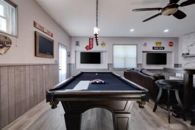 recreation area at the bridal suite, pool table, TVs on the wall, ceiling fan, Orlando, FL