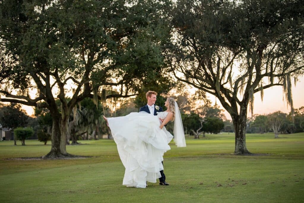 bride being dipped by her groom, outdoors, sunset, Rockledge Country Club, Orlando, FL